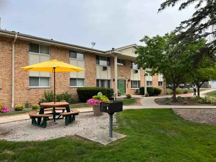 Milwaukee apartments for rent - image - flowers-courtyard-green-door-2023_orig.jpg